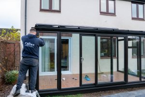 crown installer working on conservatory