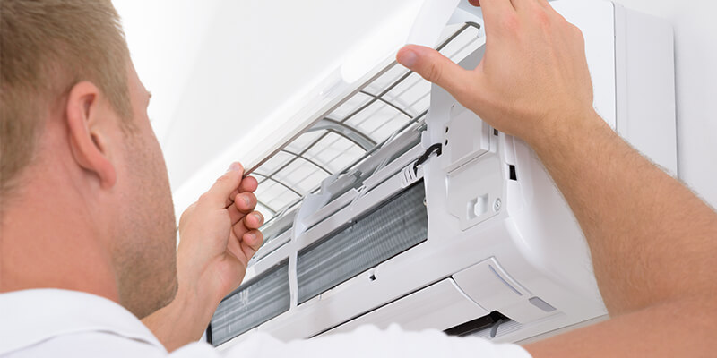 man installing air conditioning