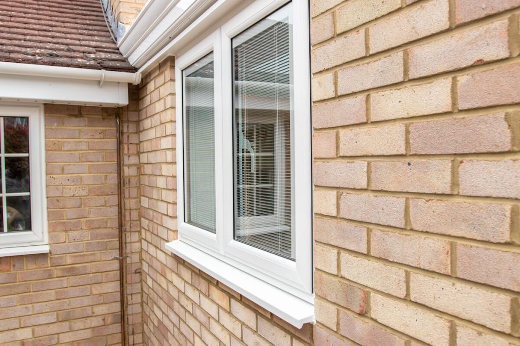 Misted double glazing: Repair vs replace and typical UK costs 3 white upvc casement window with blinds
