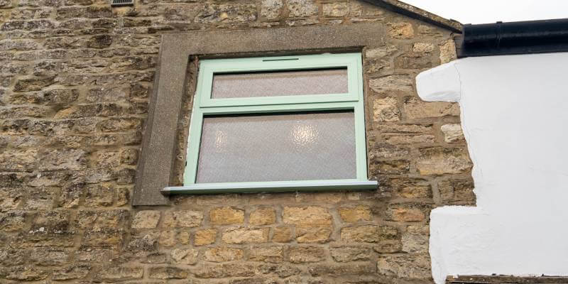 A Buyer's Guide To Aluminium Windows 5 on ladder installing windows